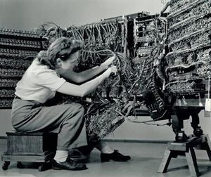 Photographer Berenice Abbott, 'Woman wiring an early IBM computer' from the Documenting Science series (1938-58)